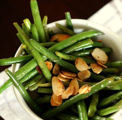 green beans in bowl with sliced almonds